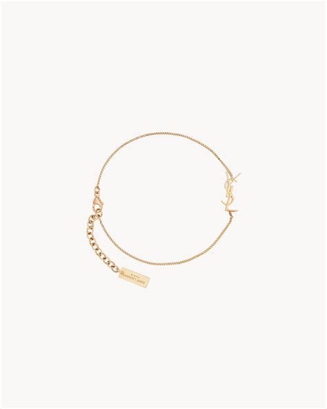 opyum charm bracelet in gold brass ysl|Saint Laurent Opyum Charm Bracelet In Gold Brass .